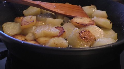Fried potatoes. Young potatoes are fried in a frying pan. Toasted crispy crust. Natural, healthy food at home