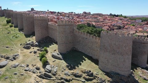 Aerial cityscape of medieval Spanish city Avila with stone defense wall