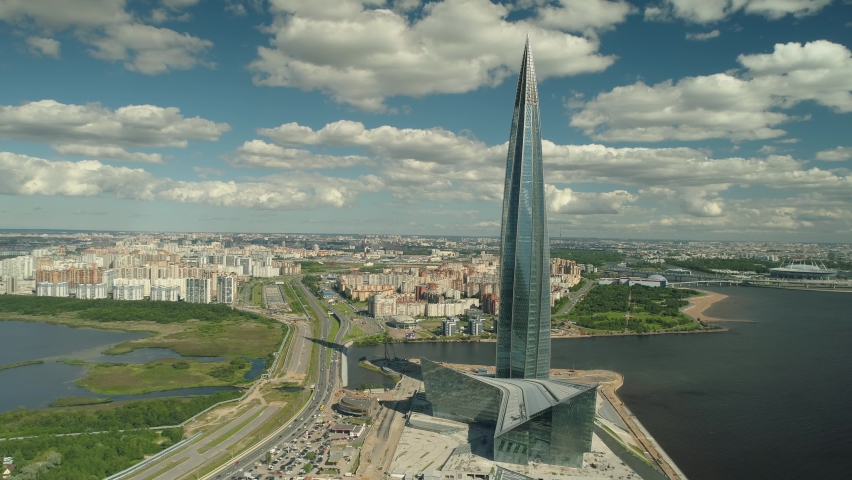 Petersburg, Russia - 12 june 2020: aerial sideways incredible cityscape center business glass tallest skyscraper Lahta in modern area of city on coast bay sea. Downtown headquarters. Travel landmark Royalty-Free Stock Footage #1076128097