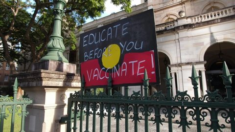 BRISBANE, QUEENSLAND, AUSTRALIA. MAY 30 2020. 'EDUCATE BEFORE YOU VACCINATE' placard at Anti Vaccine demo.