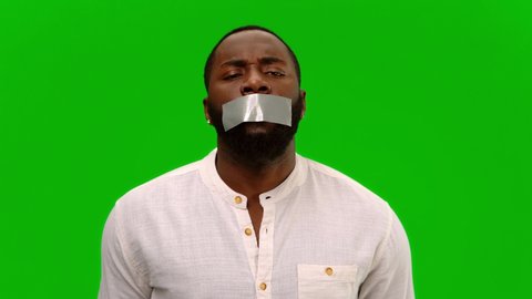 No to racism. I have a voice. Disgruntled man with adhesive tape, taped to his mouth. Alpha channel