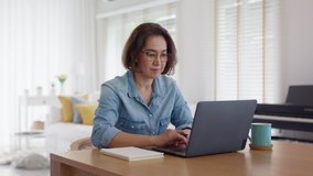 Busy asia smart people or latin sme owner sit on desk table at home enjoy read e-mail on digital tablet, smart wireless wifi 5G in money trade, smile happy female typing write search data on notebook. - Powered by Shutterstock - Get 15% off with code: PIKWIZARD15