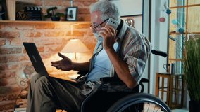 Old man in a wheelchair talking on the phone about work - Powered by Shutterstock - Get 15% off with code: PIKWIZARD15