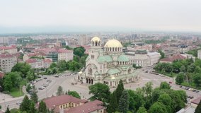 Alexander Nevsky Cathedral in the center of Sofia Bulgaria. Aerial view of a church in the European capital with old houses and neighborhoods. Drone video Balkan.
