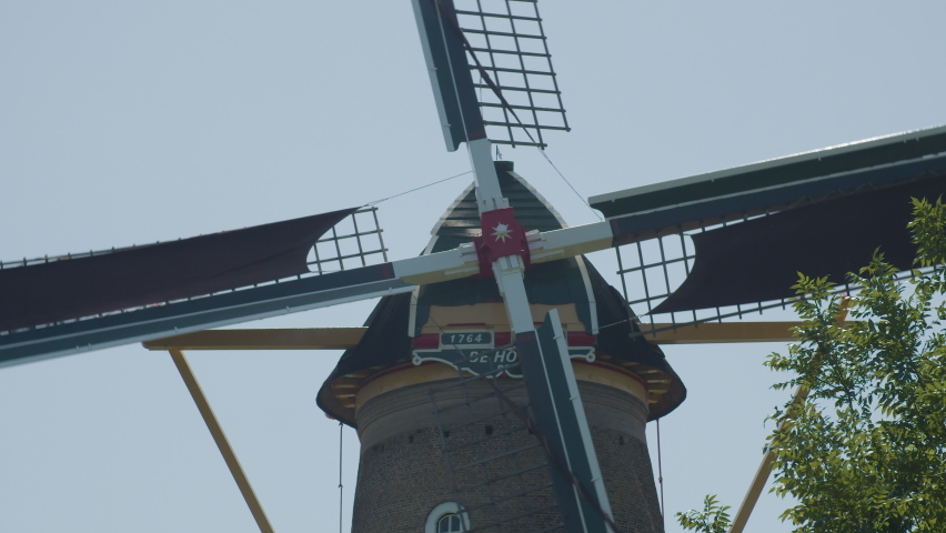 Close up of old Dutch windmill wing cross spinning