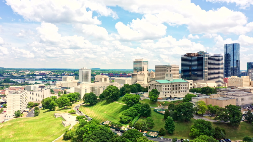 Aerial view of Nashville skyline with slow approach to the State Capitol. Nashville is the capital and most populous city of Tennessee, and a major center for the music industry