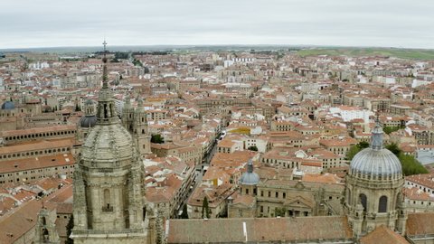 Spire And Dome Of  Cathedral Within The Cityscape Of Salamanca In Spain. aerial