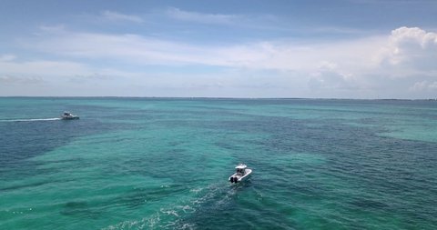 Drone footage of boats cruising in Atlantic Ocean off the coast of Islamorada, Florida Keys. Shot with Mavic Pro in 4k.