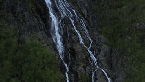 Drone clip of waterfall in Norway, tilt upwards.