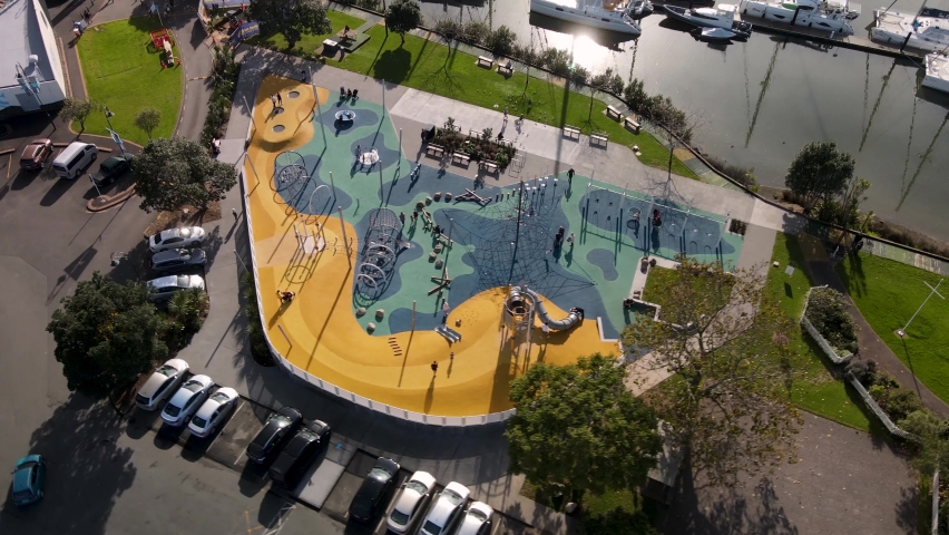 Beautiful drone shot of playground and city park on riverfront. Whangarei, New Zealand
