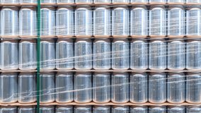 New aluminum cans stock in brewery warehouse filmed in panoramic video clip moving from left to right