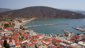 4K aerial - a bird's eye view video (Ultra High Definition) of Ermioni port. Spectacular summer seascape of Ionian sea, Peloponnese peninsula, Greece. Myrtoanian seascape. Traveling concept background