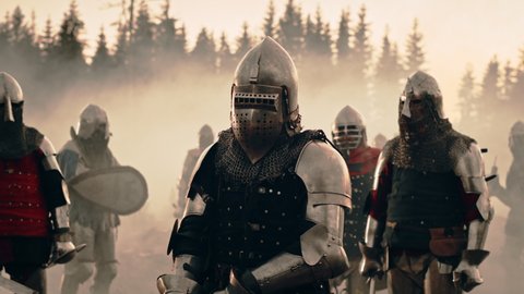 Epic Battlefield: Portrait of Knight Leader Wearing Helmet, Holding Sword, Ready for Battle. King Warrior in Dark Age Medieval War against Enemy Invasion. Cinematic Light, Historic Reenactment