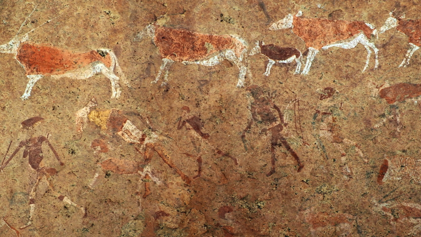 Ancient prehistoric cave painting known as the White Lady of Brandberg dating back at least 2000 years and located at the foot of Brandberg Mountain in Damaraland, Namibia, Africa.  Royalty-Free Stock Footage #1076205626