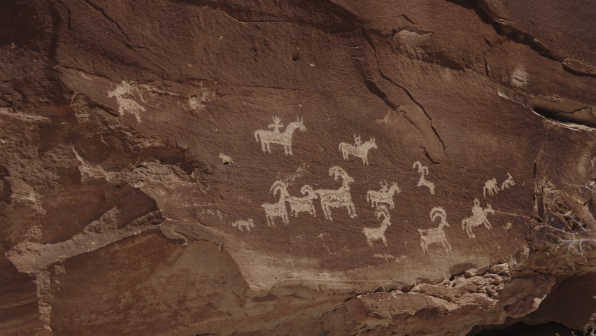 Petroglyphs etched on rock wall  Moab, Utah, United States
