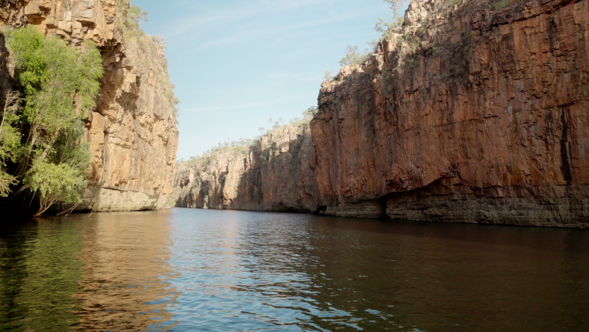 downstream view of the second gorge cliffs of nitmiluk gorge, also known as katherine gorge at nitmiluk national park in the northern territory Royalty-Free Stock Footage #1076223080