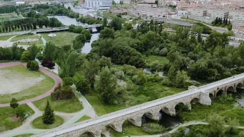Aerial View Of Puente Mayor del Tormes Crossing The Tormes River In Salamanca, Spain. drone shot