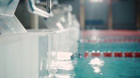 Beautiful Female Swimmer in Swimming Pool. Professional Athlete Gracefully Finished Her Lap, Rests. Confident Determined Woman Wins the Championship and Sets World Record. Cinematic Close-up - Powered by Shutterstock - Get 15% off with code: PIKWIZARD15