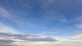 timelapse footage of Blue sky white clouds in morning. Gray cloud in sunrise.pastel soft color sky. cloudscape nature sunlight in sky. cloudy weather forecast and sunny season in a tropical country