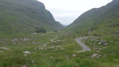 Road Traversing Narrow Mountain Pass In Killarney National Park. Most Visited Gap Of Dunloe In County Kerry, Ireland. static shot