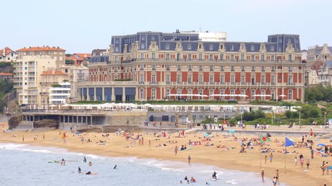 Biarritz, France - July 2021 : Grande Plage beach and Hotel du Palais palace in Biarritz, France