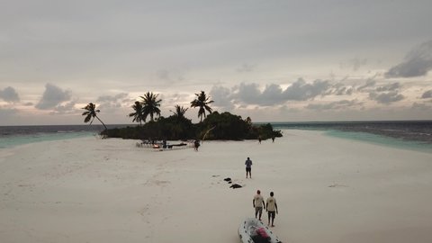 Drone Aerial video Barbeque on a white beach of a tropical and remote island on the Maldives