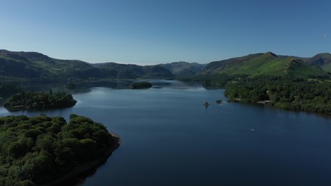 4K:  Drone Aerial Clip of Derwentwater, Keswick in the English Lake District, Cumbria, UK. Approach shot in Summer with Blue Sky. Stock Video Clip Footage