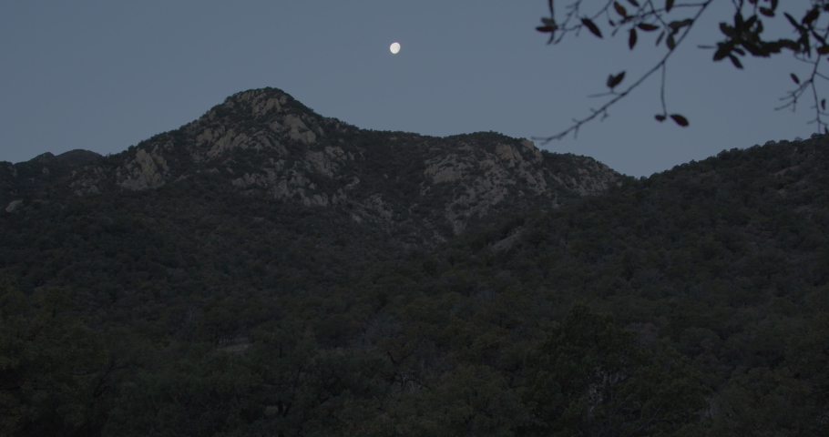 Arizona Santa Rita Mountains at Morning Low Light with Full Moon Setting
