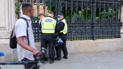 LONDON, UK – July 19, 2021: Riot Police make arrest at ‘Freedom Day’ anti-lockdown, anti-vaccination protesters at Parliament Square, London, England, UK