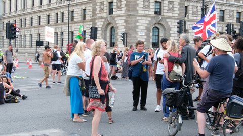 LONDON, UK – July 19, 2021: Piers Corbyn at ‘Freedom Day’ anti-lockdown, anti-vaccination protest in central London, protesters singing around Parliament Square, London, England, UK