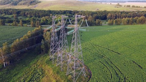 Transmission tower, power tower or electricity pylon. Steel structure framing to support or carry cable, high-voltage powerline or overhead power line