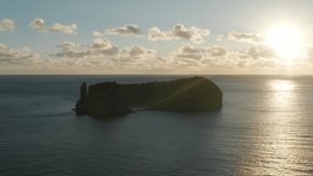 Islet of Vila Franca do Campo, Sao Miguel island, Azores, Portugal. Drone footage of volcanic formation within ocean waters. Beautiful sunset within the clouds. High quality 4k footage