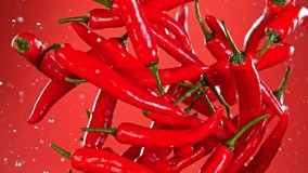 Super Slow Motion Shot of Flying Fresh Chilli Peppers. - Powered by Shutterstock - Get 15% off with code: PIKWIZARD15