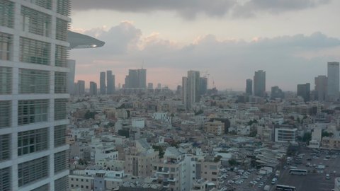 Alien invasion over large city aerial view
ufo's Armada fleet heading toward mother ship,tel aviv,drone view 
