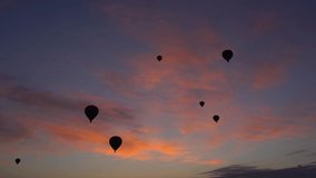 Ballooning in Cappadocia. Many hot air balloons flying in sunrise colourful spectacular breathtaking blue sunrise morning sky