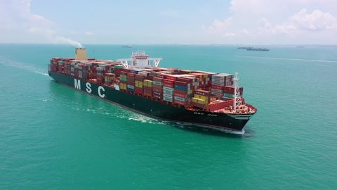 Drone shot of container ship sailing, Singapore Straits