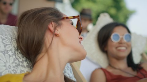 Close up video of female friends laughing at the camping. Shot with RED helium camera in 8K