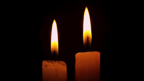 A single white candle burning. Looping for use as a background or illustration of remembrance or celebration,Stock video
Candle flame, burning. Flame of the candle in the night. Black background.