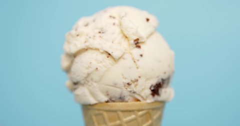 Ice cream Chocolate Chip in waffle cone isolated on blue background, Front view Food concept.