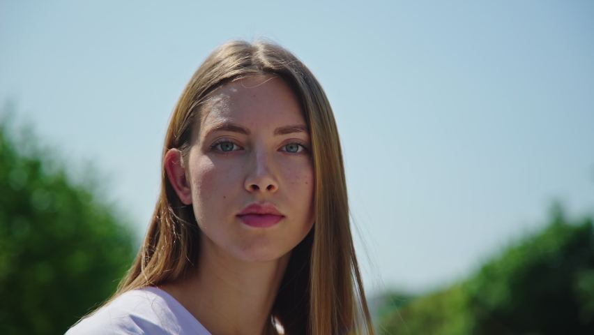 Gorgeous woman with long blonde hair and Attractive Appearance. Close up of Woman’s Face. 4K