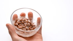 Video of mixing NATTO well on a white background.