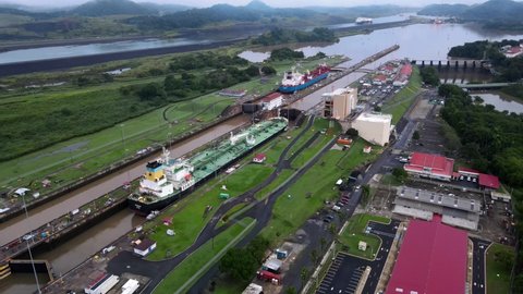Panama, Panama Panama - 07 07 2021: Beautiful cinematic aerial footage of the Panama Canal and the Miraflores Locks	
