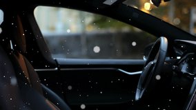 Animation of snow falling over man sitting in car. sports and competition concept digitally generated video.