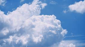 Cumulonimbus clouds in the deep blue summer sky 4K UHD - Powered by Shutterstock - Get 15% off with code: PIKWIZARD15