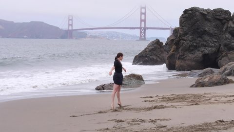 Woman Does Dramatic and Emotional Interpretive Dance on the Beach, Golden Gate Bridge in Background