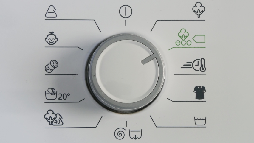 Close Up Shooting with a Hand Rotating the Front Panel Button, Switching Off the Laundry Machine from Eco Mode. Royalty-Free Stock Footage #1076356511