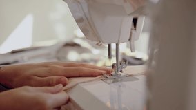 Close up fashion designer sewing clothing for women