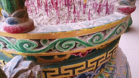 Mingyue Lay Buddhist Temple, Cabramatta, Australia - January 25 2020 : Joss sticks burns within a Buddhist Chinese Urn during Chinese New Year celebration on a warm Summer afternoon.