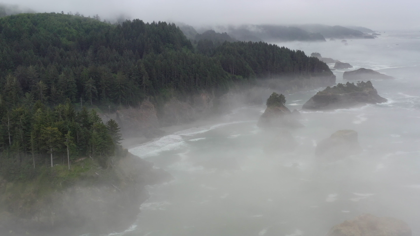 Fog drifts across the scenic coast of southern Oregon. This rugged and rocky part of the Pacific Northwest is found along the Samuel H. Boardman State Scenic Corridor.