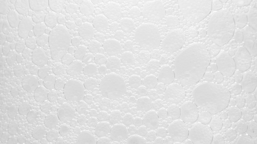 Texture of white soap foam with bubbles in the bathroom. Foam Bubbles - Bathtup Soap Foam - Foamy Bubble Texture Background | Shutterstock HD Video #1076374871
